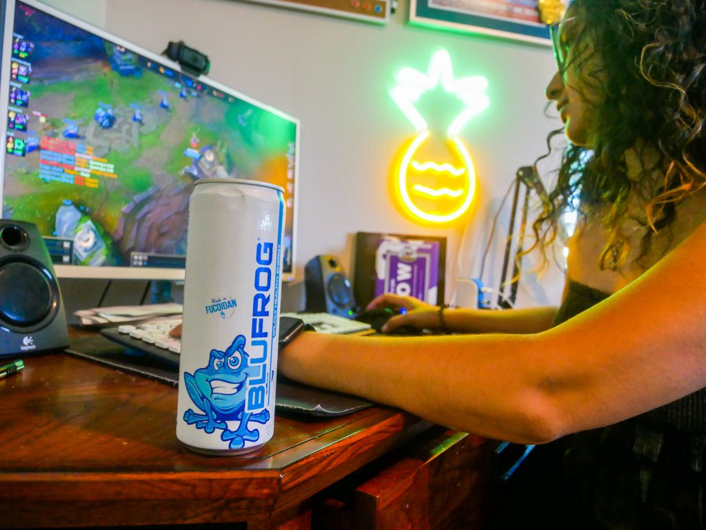 gamer playing with healthy energy drink