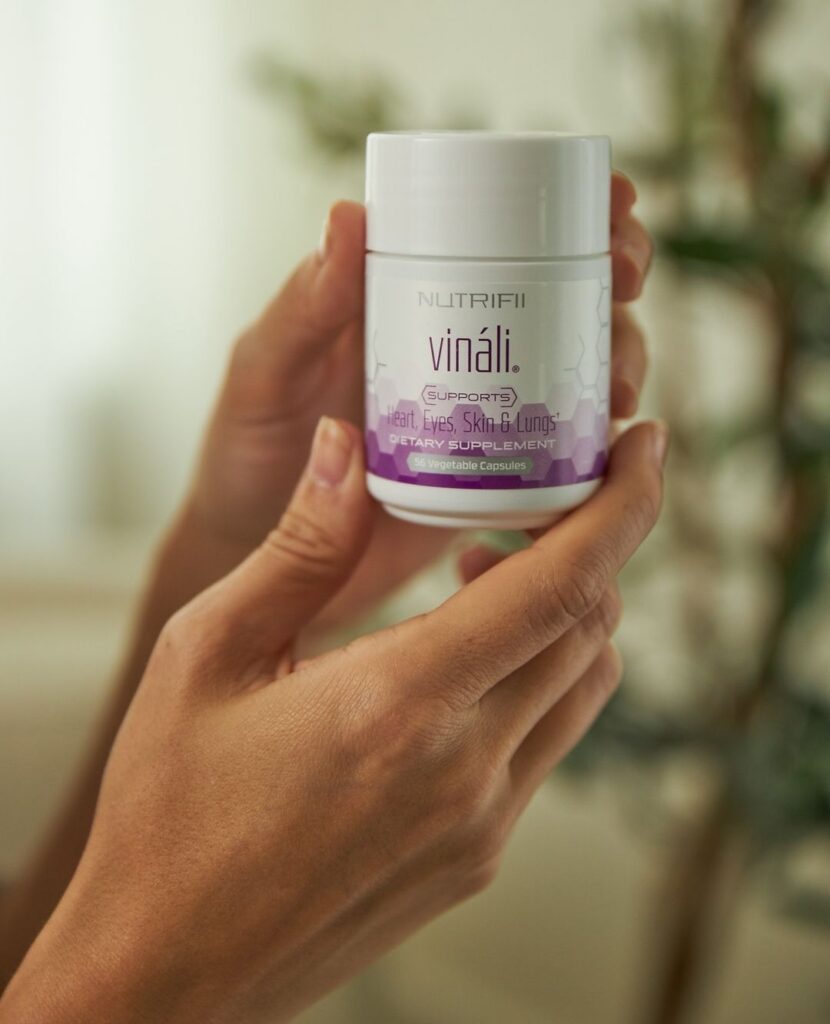 vinali supplement being held by hands